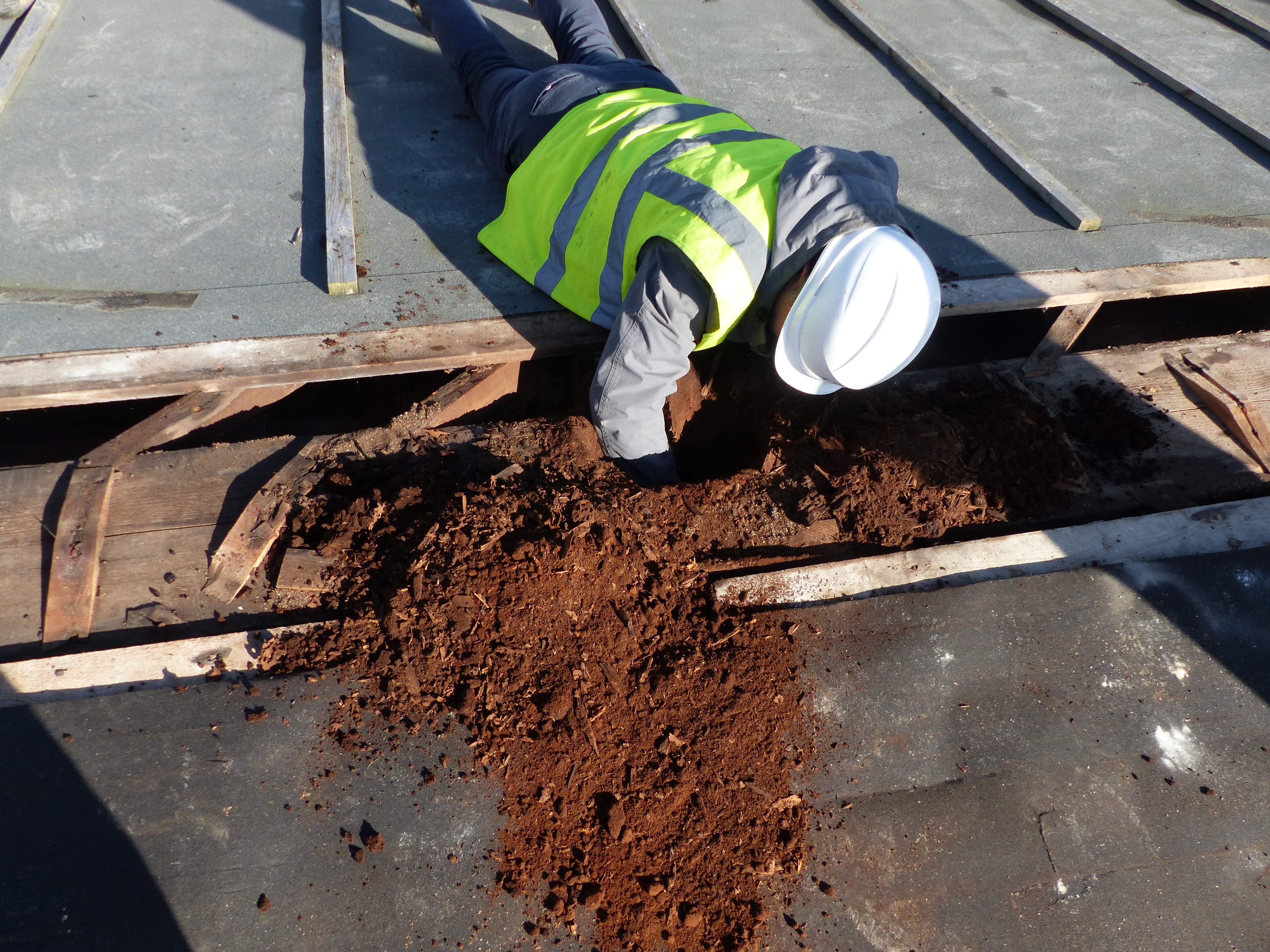 Peter Stuart (engineer) 'excavating' on nave roof